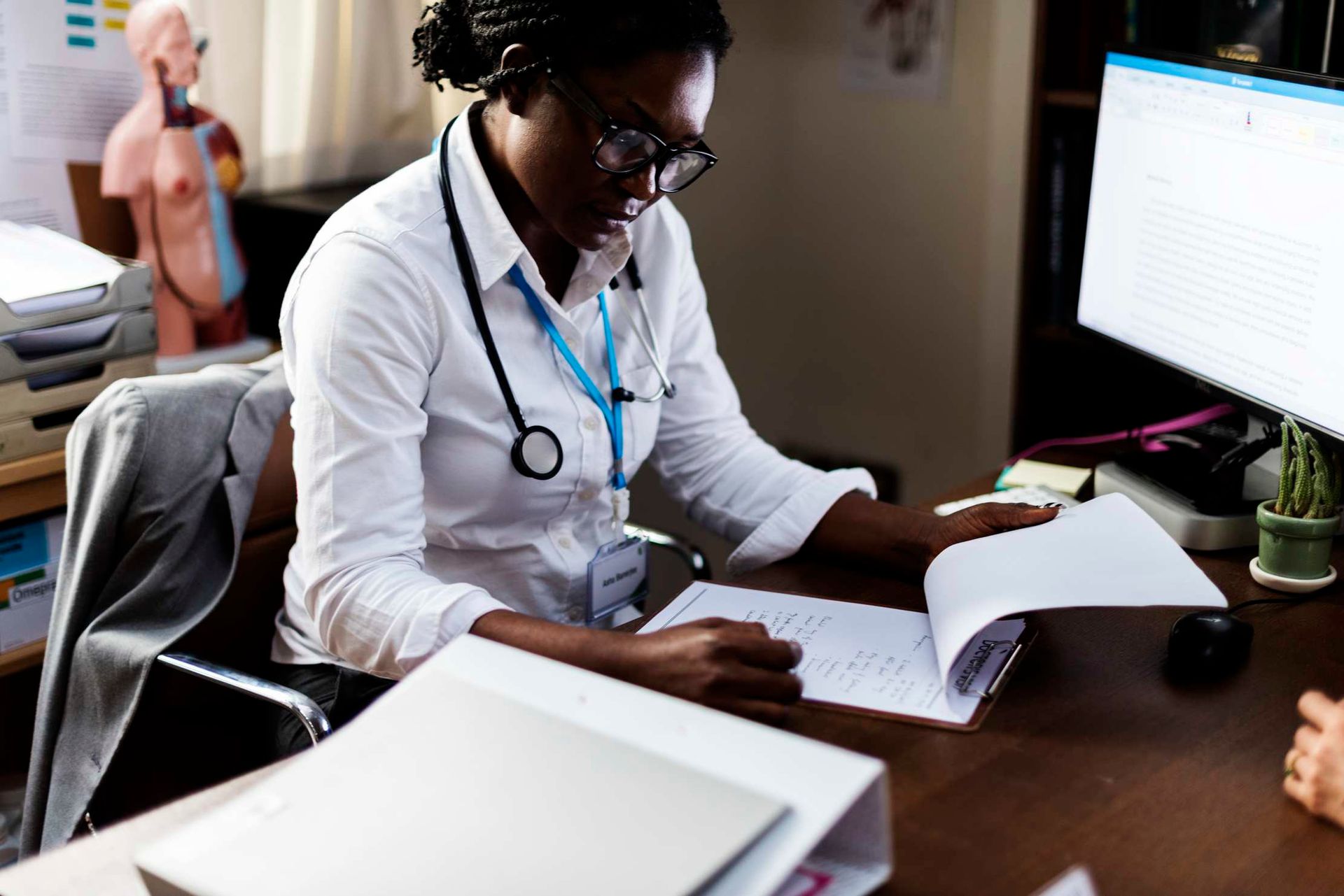 Doctor studying medical information at a desk