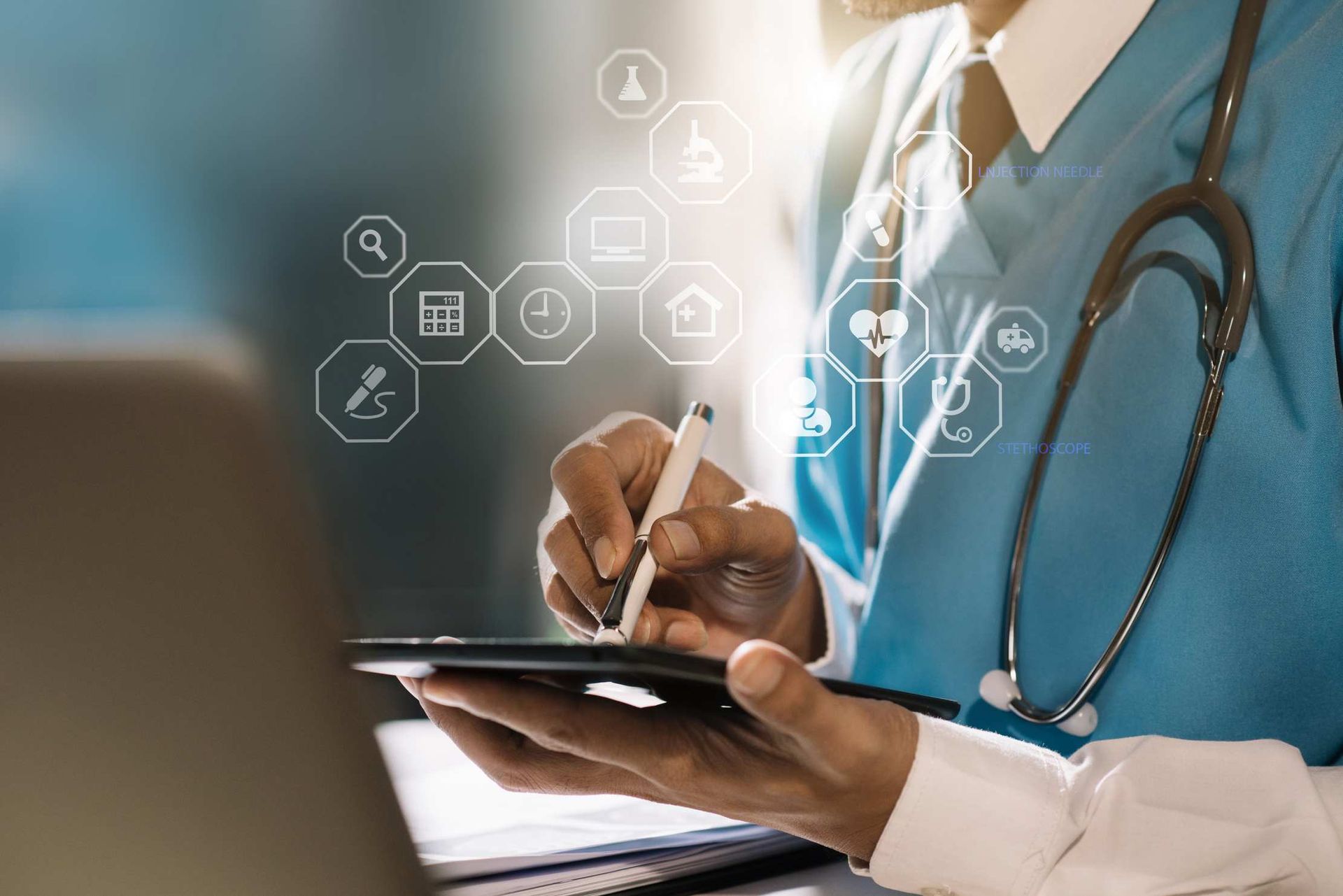 Doctor using a tablet with digital healthcare icons overlay