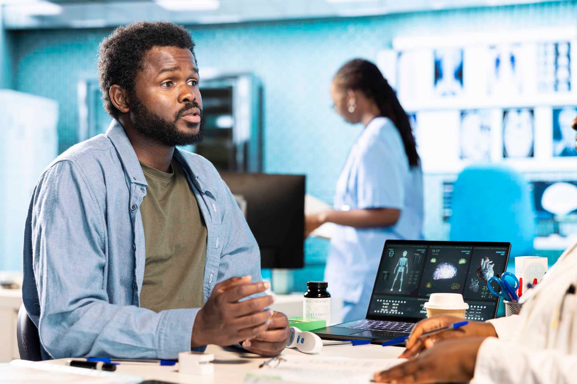 Patient seated at a medical consultation with a doctor